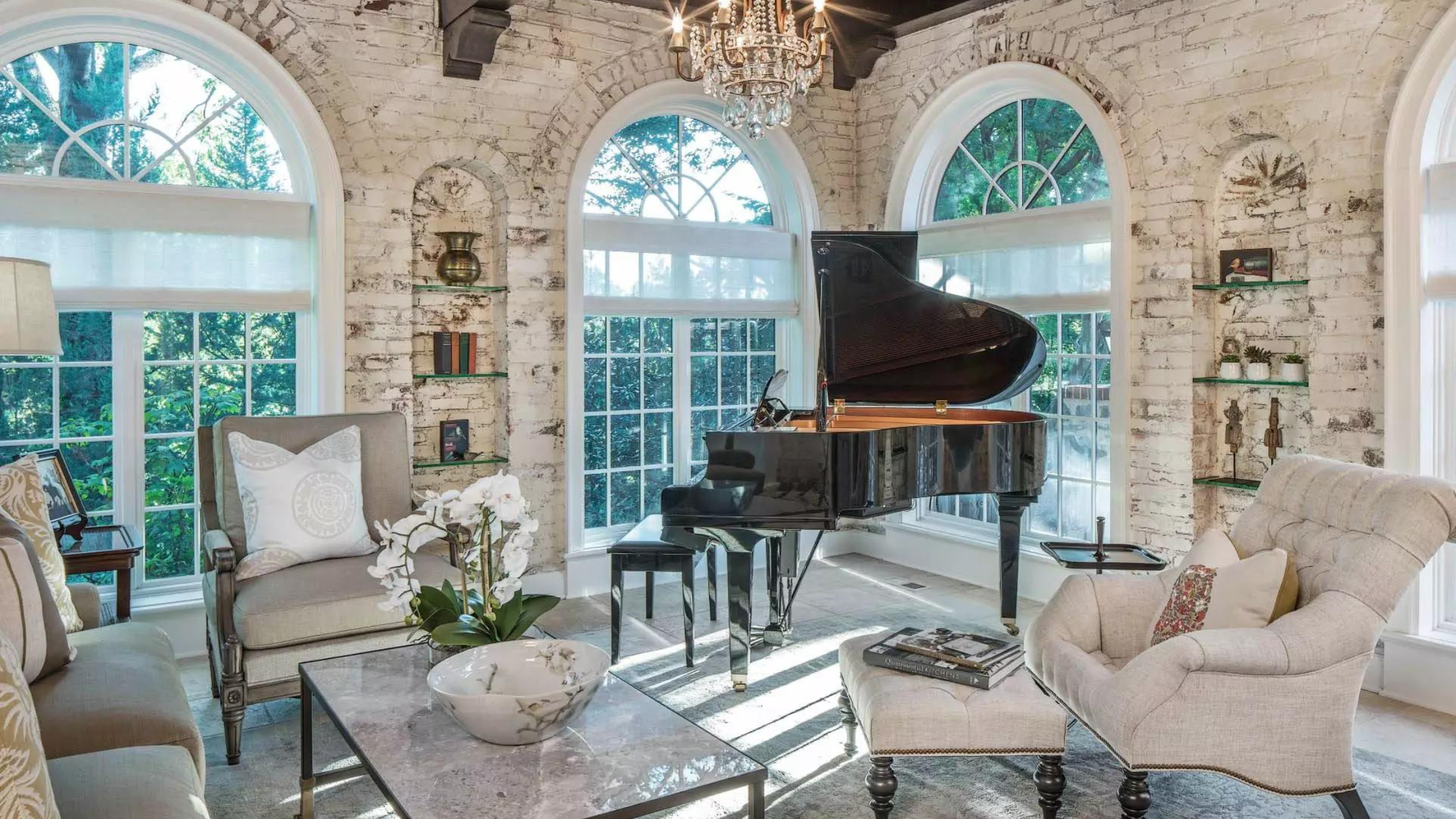 living room with a baby grand piano