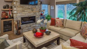 living room with a fireplace table and chairs decorated with husker decor