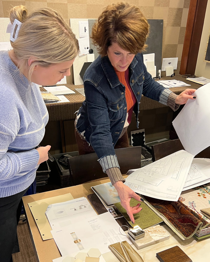 interior designer works with a client on a project